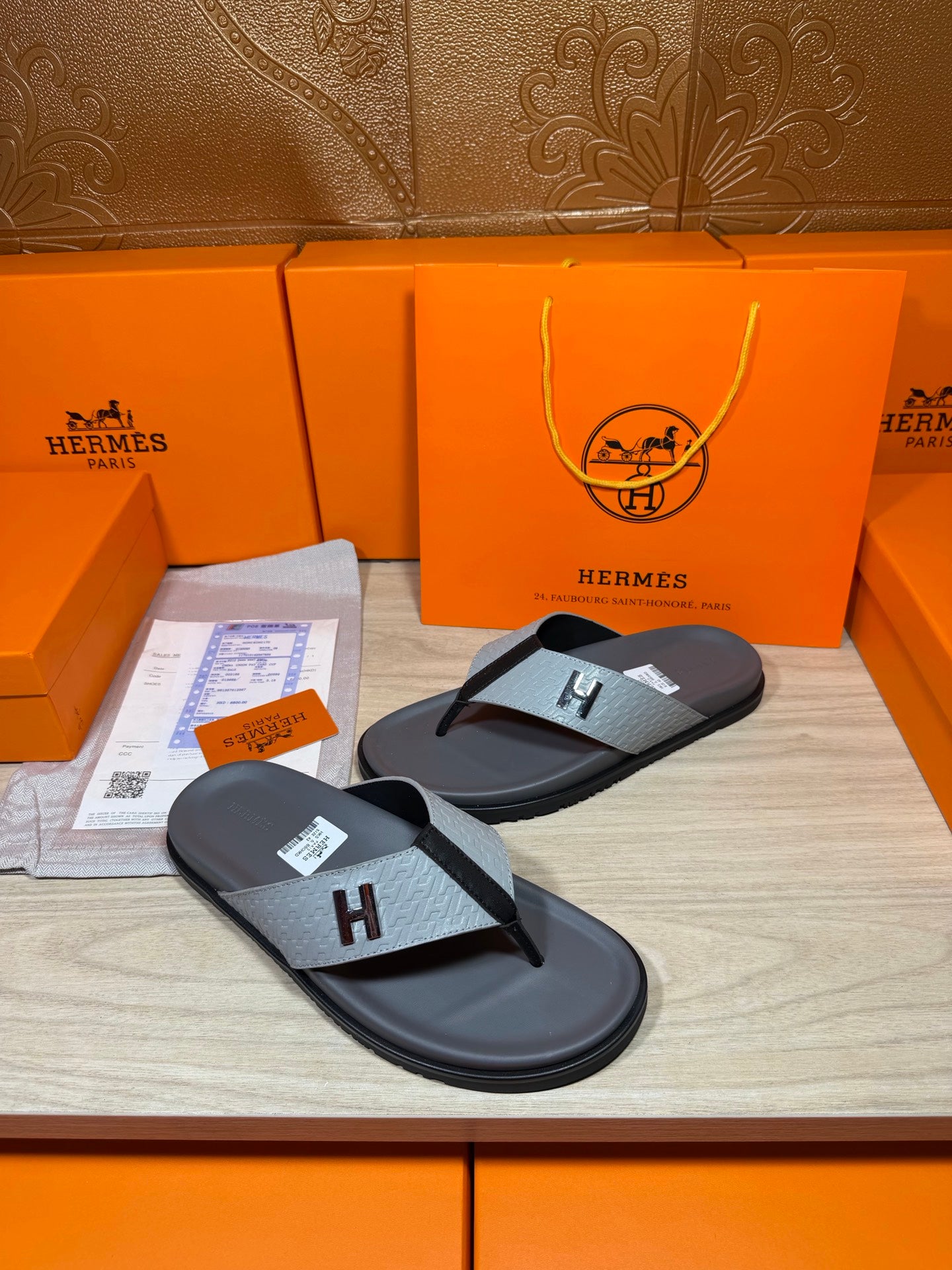 Hermes thong sandals pair, dark gray soles and gray H logo straps