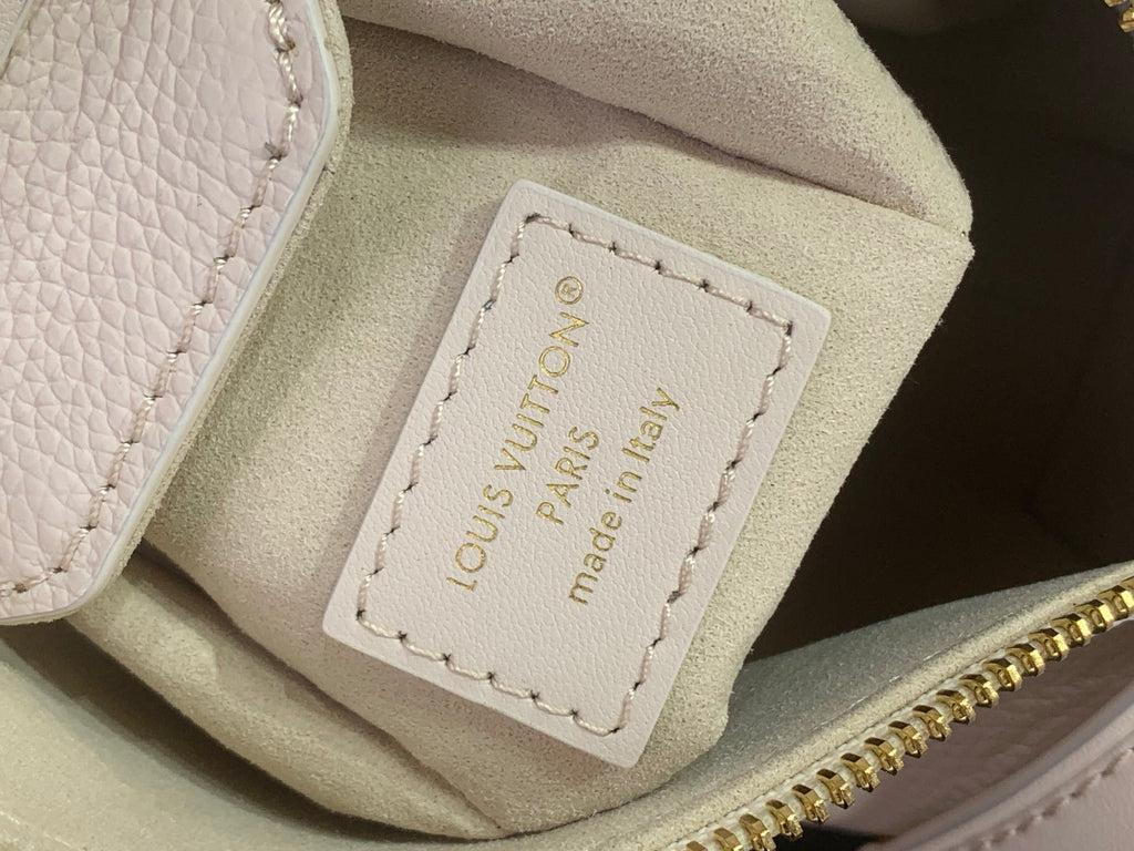 Louis Vuitton handbag interior label in beige with 'Louis Vuitton Paris' stitching