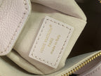 Louis Vuitton handbag interior label in beige with 'Louis Vuitton Paris' stitching