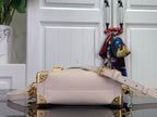 Louis Vuitton handbag in light pink leather with gold hardware and adjustable shoulder strap