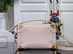 Louis Vuitton handbag in light pink leather with curved top handle and gold studs