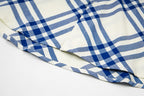 Burberry plaid shirt sleeve and side hem detail, blue-and-cream stripes and checks