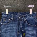 Blue denim jeans waistband with POLO Ralph Lauren logo and front pockets.