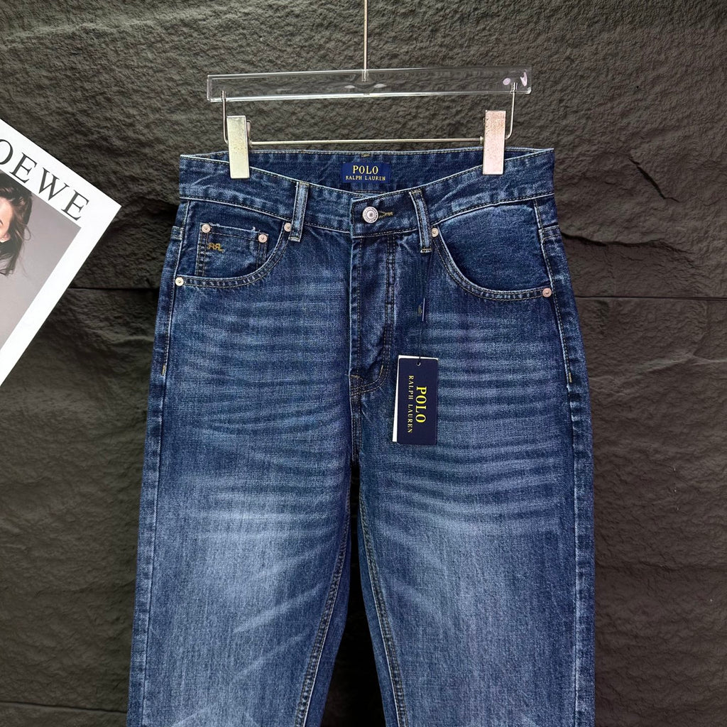 Blue denim jeans with back pockets, belt loops, and POLO tag.