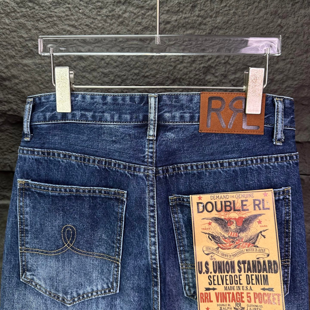 Blue denim jeans front view with belt loops, coin pocket, and RRL patch