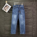 Blue denim jeans with straight leg, button-fly, and belt loops.
