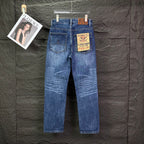 Blue denim jeans with back pockets, belt loops, and button-fly.