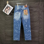 Blue denim jeans with white speckle print and label at waistband, straight legs.