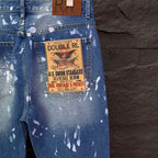 Blue denim jeans with white speckle print and Double RL vintage pocket label patch.