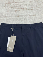 Dior navy pants with drawstring waist and hanging brand tag