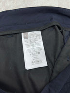 Dior navy pants with care label inside near the waistband