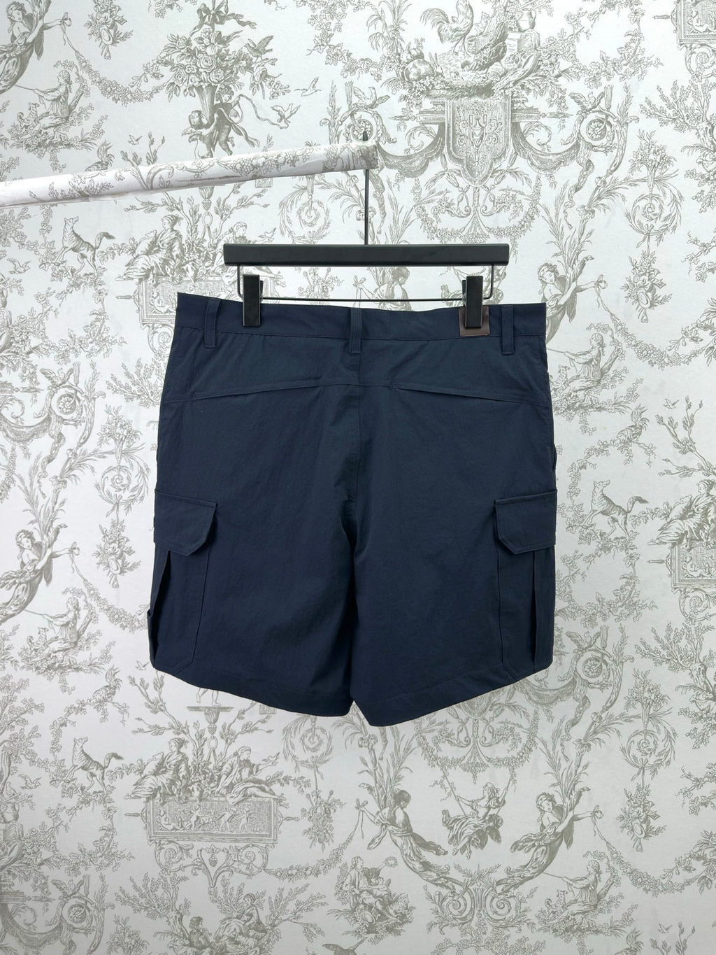 Dior navy shorts-style pants with cargo pockets and buttoned waistband