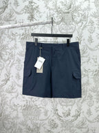 Dior navy pants with cargo-style side pockets and belt loops