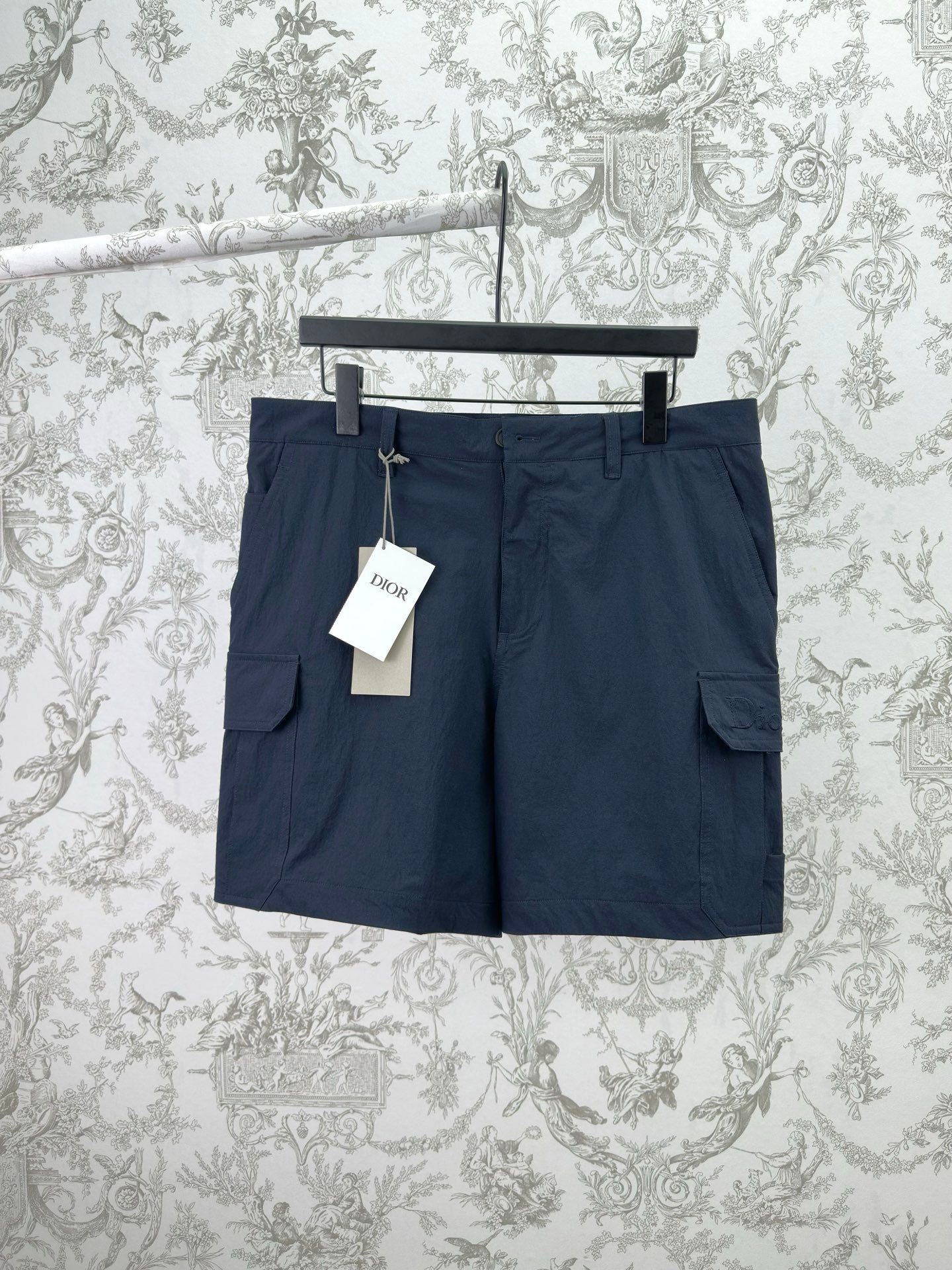 Dior navy pants with cargo-style side pockets and belt loops