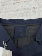 Dior navy pants showing interior waistband and pocket opening