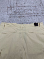 Light yellow shorts back view with waistband tab and belt loops