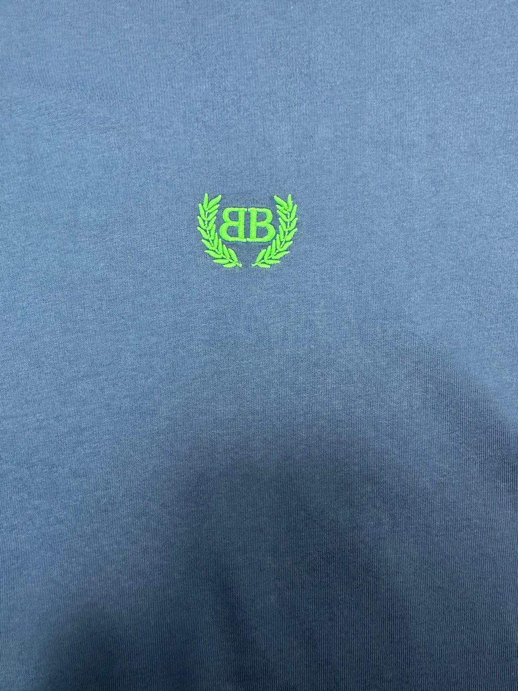 Balenciaga blue T-shirt with neon green crest logo on chest
