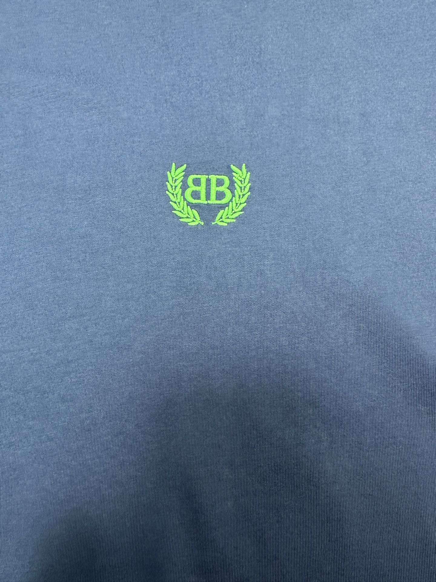 Balenciaga blue T-shirt with neon green crest logo on chest