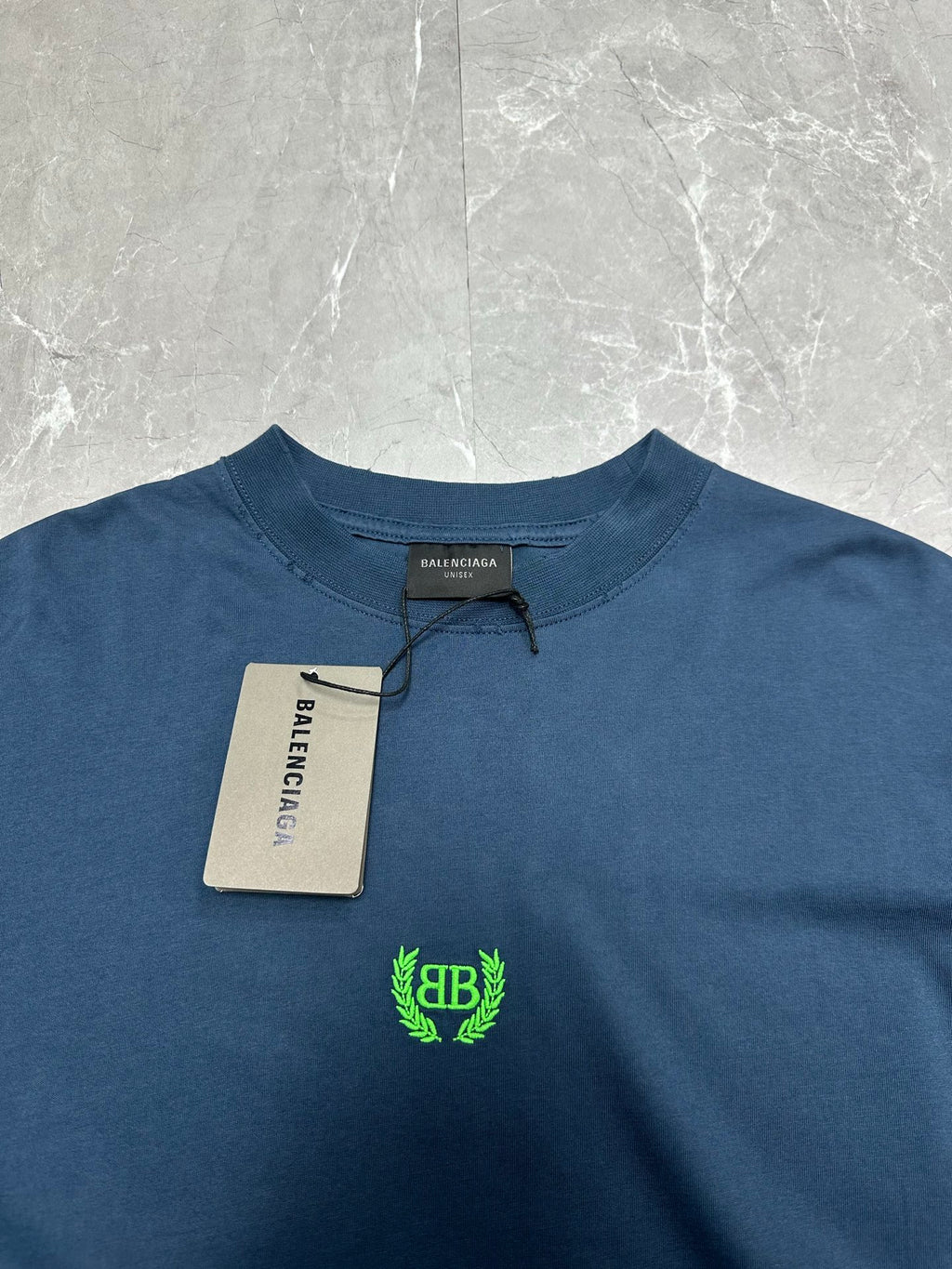 Balenciaga blue crew-neck T-shirt, neckline with green logo and size tag