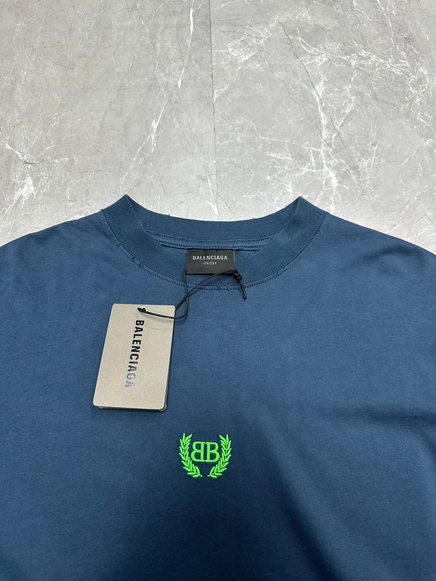 Balenciaga blue crew-neck T-shirt, neckline with green logo and size tag