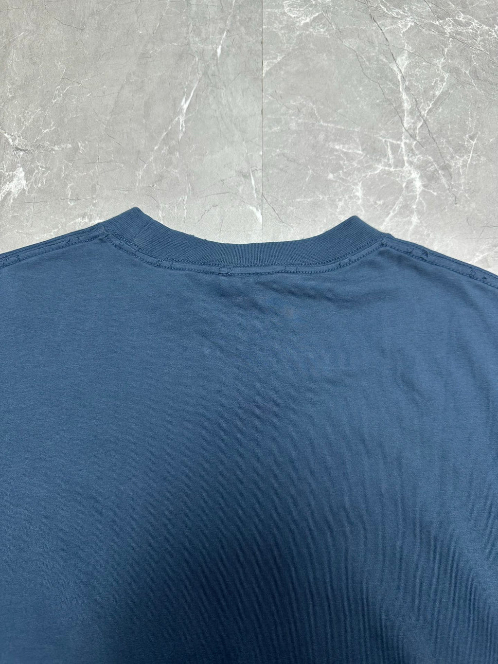 Balenciaga blue T-shirt crew neckline close-up