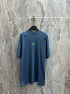 Balenciaga blue crew-neck T-shirt with small green logo at chest