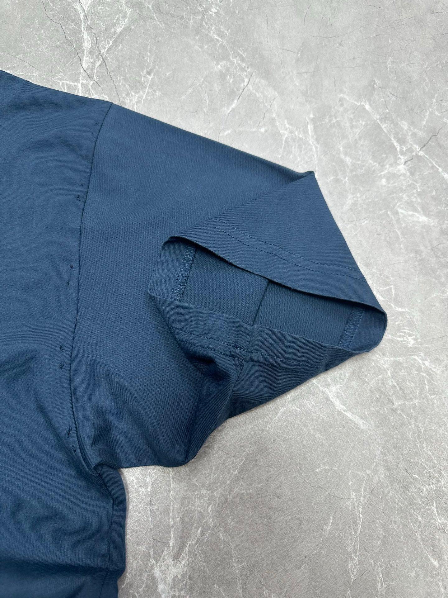 Balenciaga blue T-shirt sleeve cuff and side seam detail