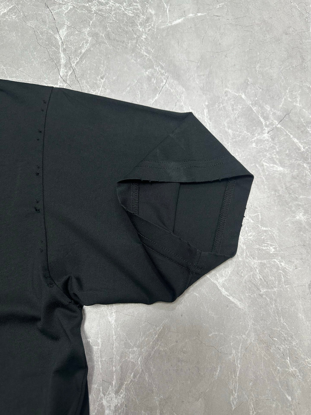 Black short-sleeve T-shirt with draped sleeve and stitched side seam