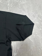 Black short-sleeve T-shirt with draped sleeve and stitched side seam