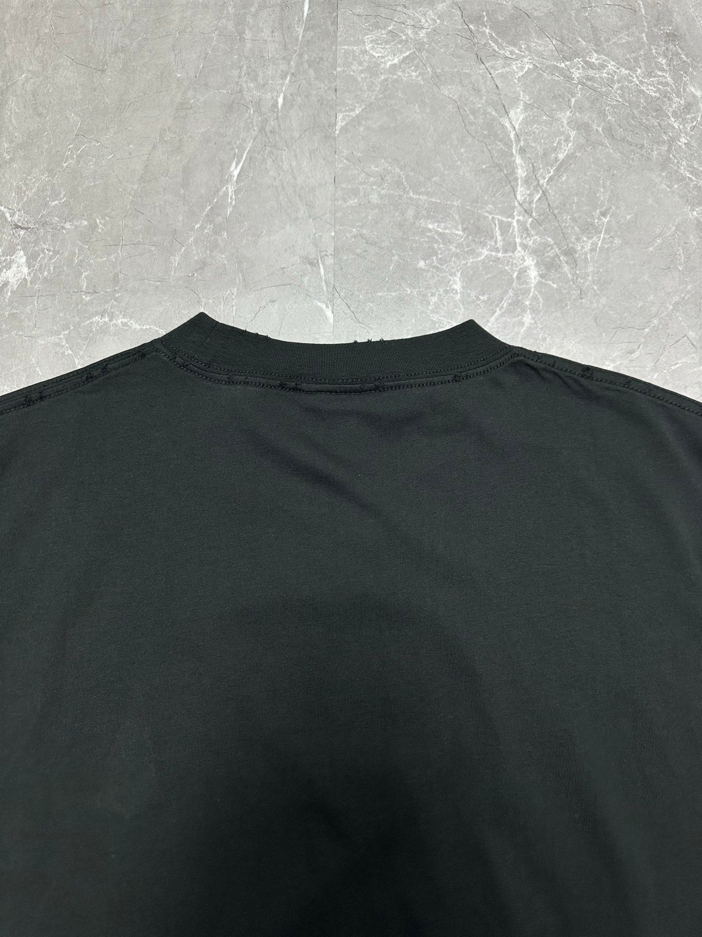 Black short-sleeve T-shirt back neckline with crew collar
