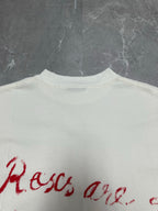 White T-shirt back close-up of red script logo text