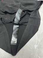Black T-shirt with V-neck and multiple neck label tags