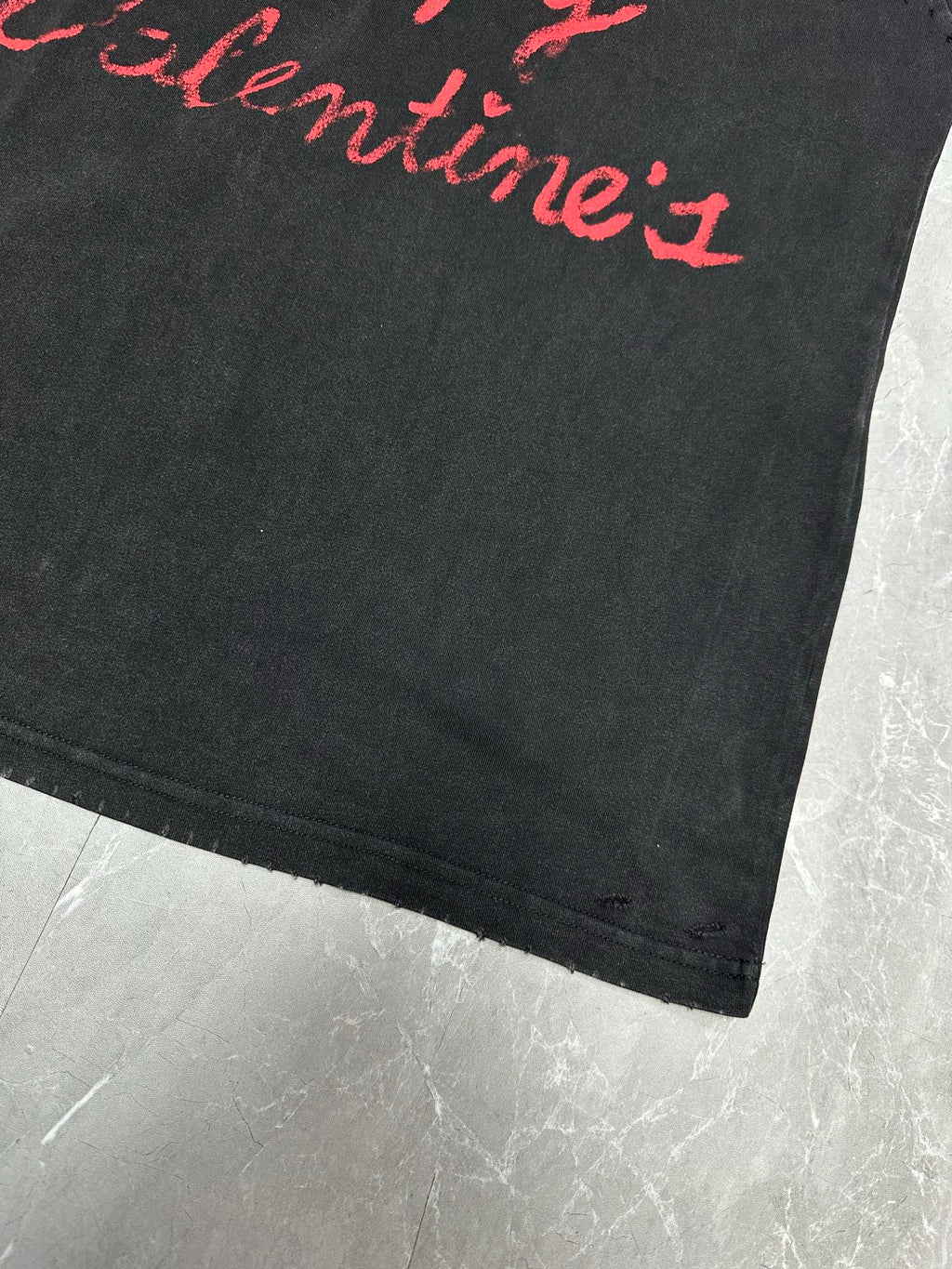 Dark gray short-sleeve T-shirt, partial red script lettering and straight hem