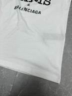 Balenciaga white short-sleeve T-shirt with partial BALENCIAGA text at hem
