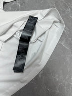 Balenciaga white short-sleeve T-shirt, close-up of care label on inner collar