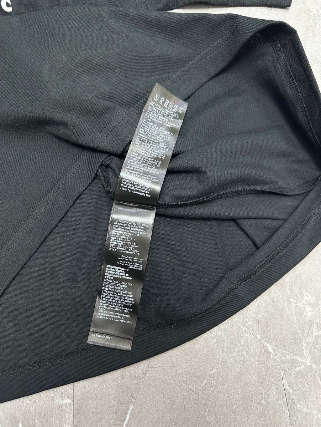 Balenciaga short-sleeve T-shirt, black, close-up of neck label and seam