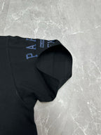 Black short-sleeve T-shirt with blue Balenciaga logo stripe on sleeve hem.