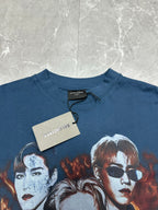 Blue graphic T-shirt close-up with Balenciaga brand tag at the collar
