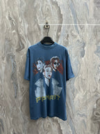 Blue graphic T-shirt with large front portrait print and yellow lettering