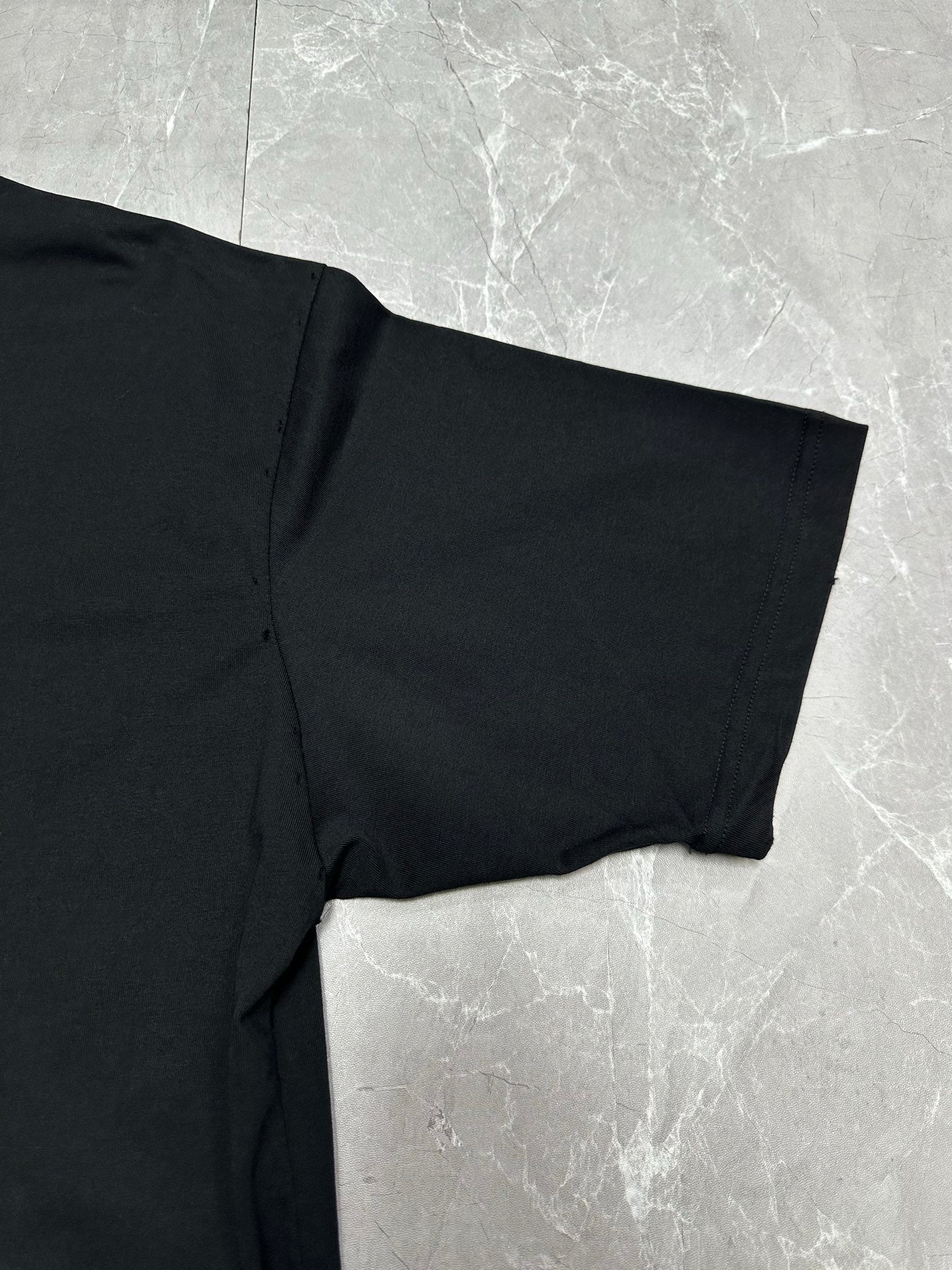 Balenciaga black T-shirt bottom hem and side seam detail