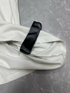 White T-shirt hem with black care label tag