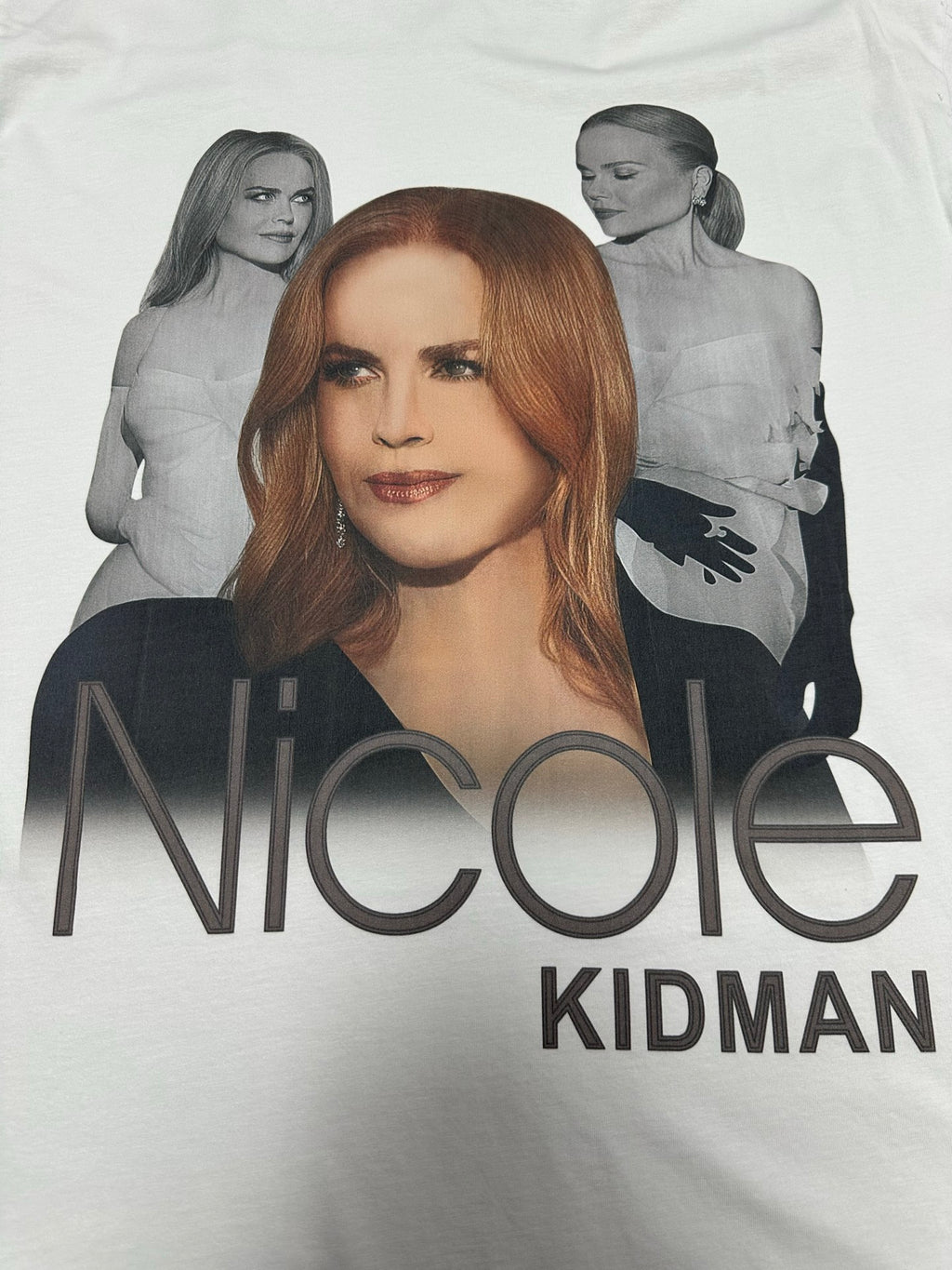 White graphic T-shirt with “Nicole” and “Kidman” text across the front