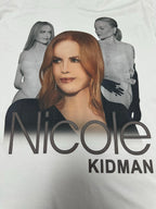 White graphic T-shirt with “Nicole” and “Kidman” text across the front