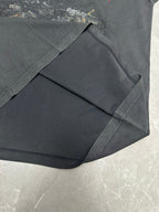 Dark charcoal T-shirt flat lay showing front and sleeve folds