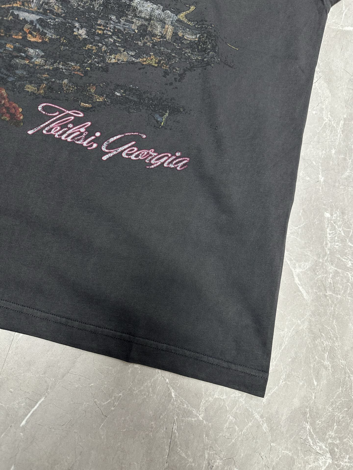 Dark charcoal T-shirt with 'Tbilisi, Georgia' graphic near bottom hem