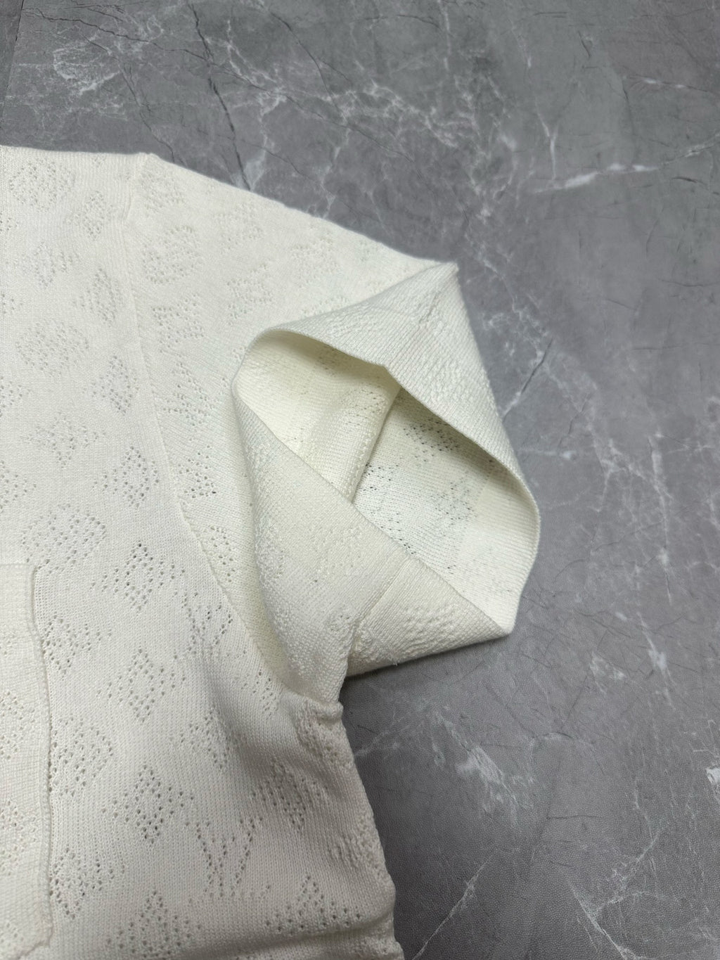 Louis Vuitton short-sleeve button-up shirt, white, textured fabric close-up