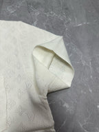 Louis Vuitton short-sleeve button-up shirt, white, textured fabric close-up