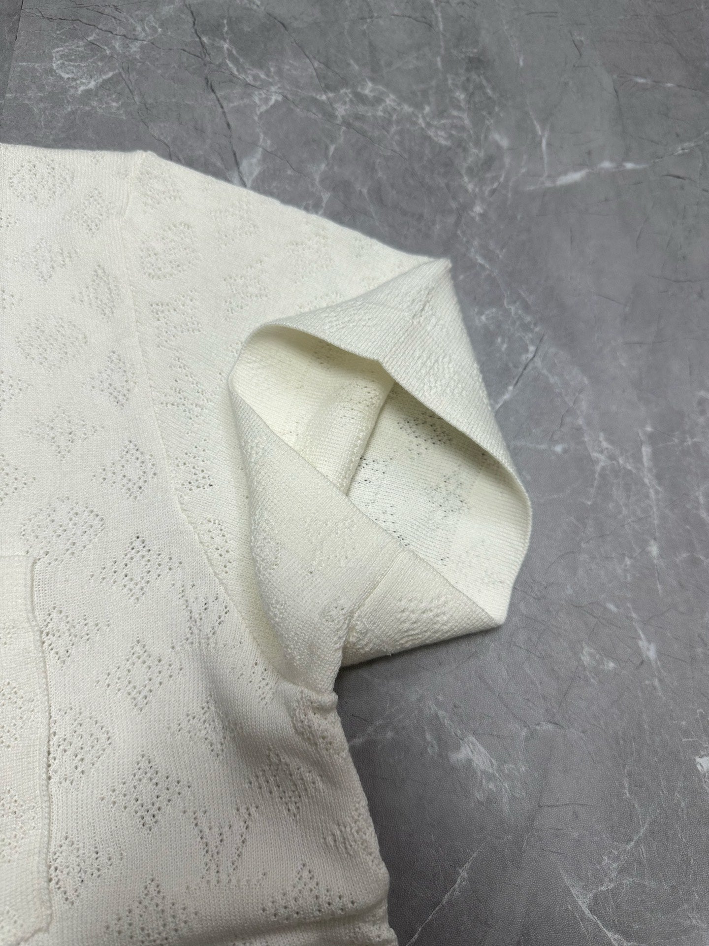 Louis Vuitton short-sleeve button-up shirt, white, textured fabric close-up