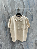 Louis Vuitton short-sleeve polo shirt, light beige knit, button front and chest pocket