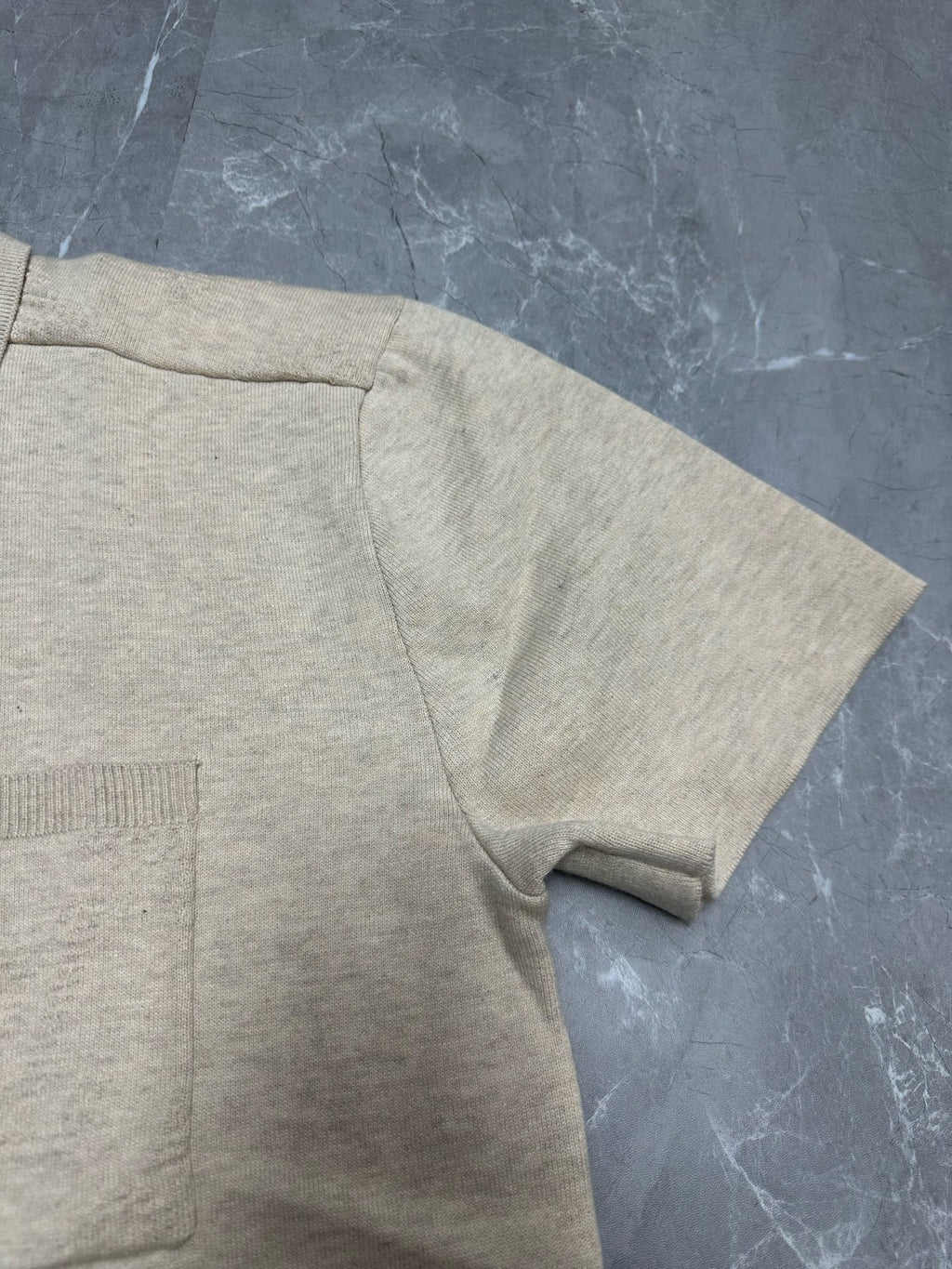 Light beige polo shirt sleeve and side seam, ribbed cuff trim
